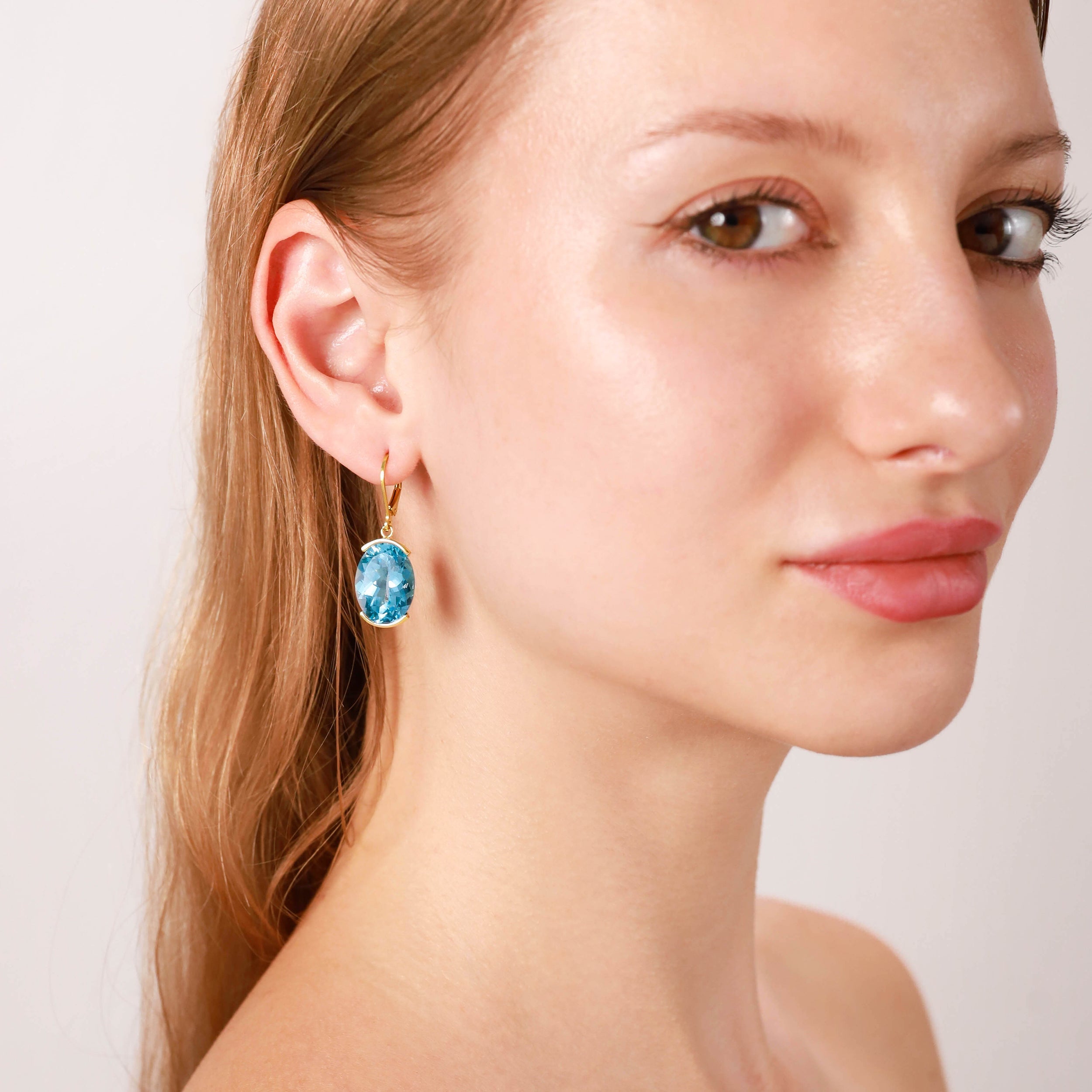 Silvershake 21.66ct. Genuine Oval Shape Blue Topaz White Gold Plated 925 Sterling Silver Leverback Earrings - Silvershake-store