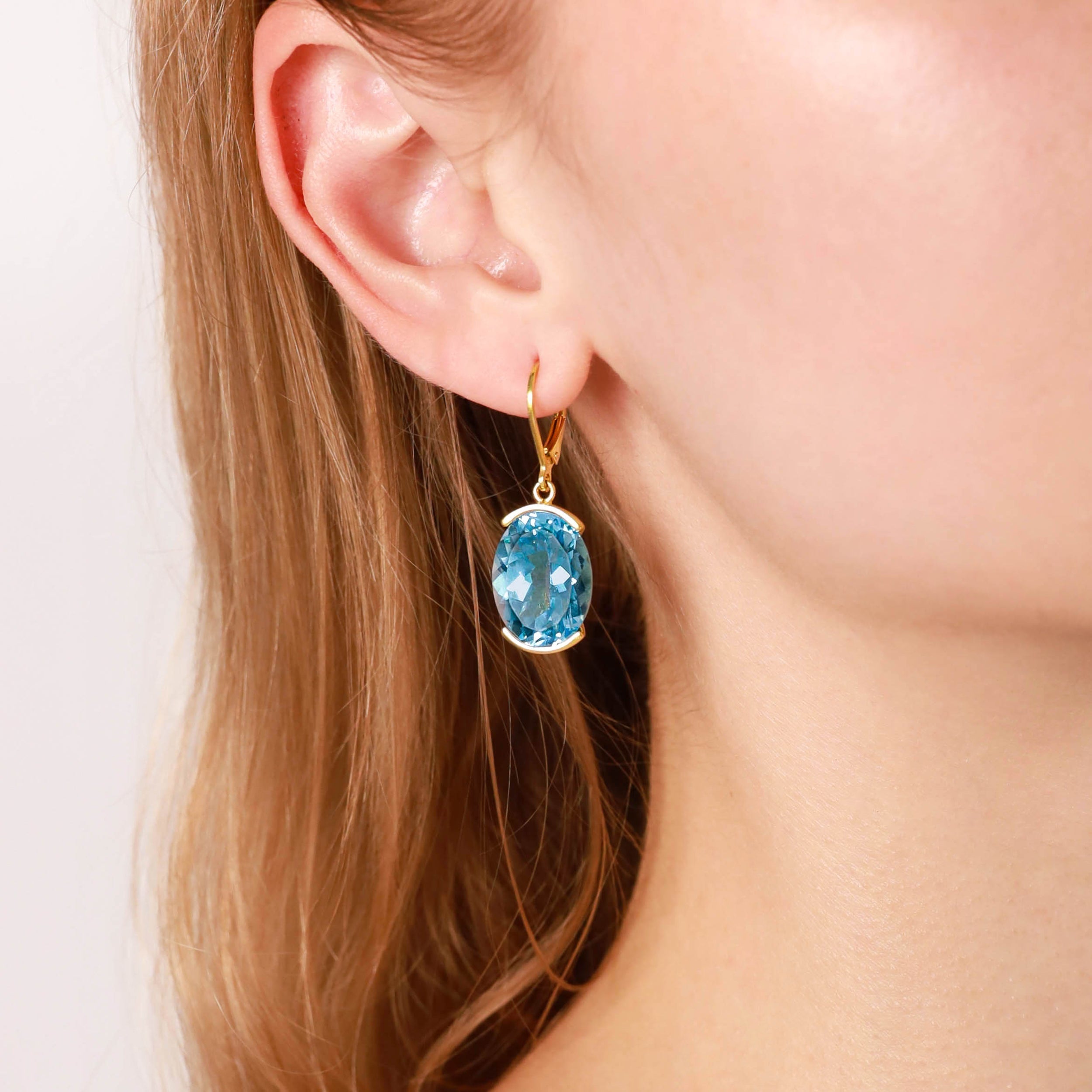 Silvershake 21.66ct. Genuine Oval Shape Blue Topaz White Gold Plated 925 Sterling Silver Leverback Earrings - Silvershake-store